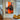 Hand-painted abstract cityscape with orange and black palette knife textures