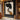 Abstract oil painting of a female profile with layered black silhouettes against a textured beige background, blending white and ochre accents.