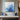 Minimalist abstract painting in layered icy blue and white tones with thick paint texture