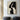 Abstract minimalist painting of intertwined female faces in black and beige