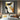 Modern abstract oil painting with gold leaf textures intersecting bold black geometric shapes and taupe grey accents on white linen canvas.