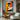 "Chromatic Muse" abstract portrait painting of a face in profile using bold blocks of orange, blue, black, and white with red lips, in a modern graphic style.