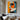 "Chromatic Muse" abstract portrait painting of a face in profile using bold blocks of orange, blue, black, and white with red lips, in a modern graphic style.
