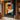 "Chromatic Muse" abstract portrait painting of a face in profile using bold blocks of orange, blue, black, and white with red lips, in a modern graphic style.