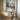 Metallic abstract cityscape painting with golden lights and water reflections