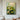 "Emerald Lotus Dream" abstract oil painting depicting serene green and white lotus flowers and pads with expressive brushwork in a contemporary floral style.