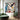 square colorful drip painting with red, blue, yellow, and black strokes in Pollock style