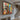 Graffiti-style abstract oil painting with distorted faces and bold red, blue, and yellow accents