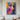 Abstract oil painting of a woman’s face in geometric mosaic style with bold pink, orange, and blue tones