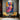 Abstract oil painting of a woman’s face in geometric mosaic style with bold pink, orange, and blue tones