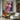 Abstract oil painting of a woman’s face in geometric mosaic style with bold pink, orange, and blue tones