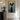 Graffiti abstract cat painting with large black eyes on blue and yellow background