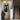 Graffiti abstract cat painting with large black eyes on blue and yellow background