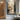 Impressionist City Street Oil Painting in Warm Golden Light with Silhouetted Woman