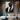 Minimalist oil painting of a black geometric suit silhouette with angular facial planes and diagonal composition on ivory background.