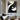 "Minimalist Plane" 2D abstract oil painting featuring a composition of flat geometric and organic shapes in black, white, grey, and touches of gold, in a contemporary minimalist style.