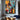 "Neon Velocity" abstract oil painting in a pop art and graffiti style, featuring vibrant streaks of neon-like colors (yellow, red, blue) over a dark, abstracted urban background.