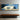 Panoramic Impressionist Oil Painting of White Sleeping Cat in Soft Blue and Cream