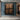 Original geometric abstract oil painting "Quadra Panels" depicting four textured brown rectangular panels against a dark background, creating a modern, structured look.