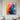 "Spectrum Dance" abstract oil painting featuring a vibrant and dynamic interplay of multiple colors including yellow, orange, red, blue, and purple, with expressive, textured brushstrokes.