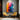 "Spectrum Dance" abstract oil painting featuring a vibrant and dynamic interplay of multiple colors including yellow, orange, red, blue, and purple, with expressive, textured brushstrokes.