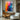 "Spectrum Dance" abstract oil painting featuring a vibrant and dynamic interplay of multiple colors including yellow, orange, red, blue, and purple, with expressive, textured brushstrokes.
