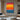 Color stripe abstract canvas art with vibrant sunset tones in red, orange, yellow, and blue