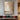 Abstract oil painting mimicking organic wall surfaces with layered beige and gray brushstrokes, rough textures transitioning from light to dark tones.