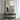Minimalist abstract painting with a lone figure in a soft gray and beige city scene