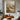 abstract textured canvas in beige tones with flowing wave-like brushwork