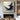 Abstract oil painting of a soaring bird formed by swirling black and white brush strokes