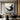 Abstract oil painting of a soaring bird formed by swirling black and white brush strokes