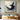 Abstract oil painting of a soaring bird formed by swirling black and white brush strokes