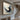 Abstract oil painting of a soaring bird formed by swirling black and white brush strokes
