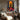 Abstract Silhouette of Afro Woman with Raised Hands Toward the Sun in Colorful Patchwork Dress