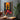 Abstract Silhouette of Afro Woman with Raised Hands Toward the Sun in Colorful Patchwork Dress