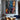 Abstract oil painting with explosive color splashes in white, blue, orange, and pink intersecting on black textured canvas.  