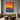 Horizontal abstract canvas art with bold color stripes in red, yellow, blue, and purple