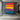 Horizontal abstract canvas art with bold color stripes in red, yellow, blue, and purple