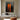 Abstract oil painting of two tall orange silhouettes with mirrored reflections, standing against a deeply textured charcoal-black background.  
