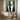 Abstract oil painting of embracing black and white silhouettes with fluid curves, contrasting against a textured sage green linen canvas background.?
