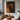 Abstract oil painting of a bold orange female silhouette with minimalist curves against a deep charcoal-black background.