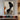 Abstract oil painting of a black female profile with orange and grey curved shapes, textured ivory background, and minimalist composition.  