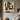 Abstract geometric face painting in muted earth tones with minimalist structure and strong outlines