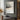 Abstract oil painting with layered gray tones, central metallic vein dividing charcoal upper zone and pale gray base, warm umber flecks and drip textures visible.  