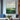 Abstract oil painting of green landscape with golden textured accents and natural earth tones.