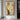 Abstract minimalist painting with two intertwined faceless figures in beige and caramel tones
