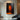 Abstract orange and black oil painting of two figures side by side
