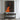 Abstract oil painting of a silhouette figure with orange drips and textured brushstrokes on black canvas background.