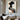 Abstract oil painting of a human profile with fluid black and white overlapping shapes on a light beige textured background.